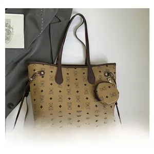 Detail view of large caramel tote bag with bear pattern and matching round coin purse