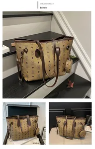 Brown tote bag with bear print and round coin purse shown against a monochrome staircase