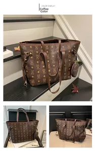 Detail view of large brown tote bag set with bear patterns and round pendant charm