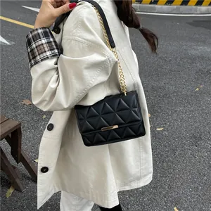Classic black quilted shoulder bag with gold chain strap and elegant metallic trim