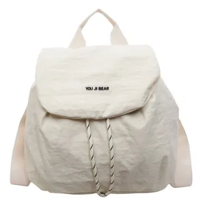 Contrast fabric backpack in cream white with flap and drawstring closure for women