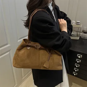 Brown vintage suede tote bag for women shown as a stylish large shoulder handbag