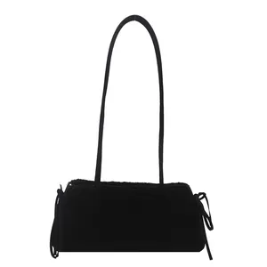 Minimalist black lamb wool shoulder bag with stylish side drawstring bow details