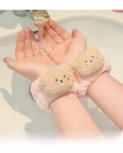 Pink coral fleece wristbands with cute bear decor preventing water from wetting sleeves
