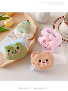 Detail of plush cartoon wristbands and headbands in coral fleece with cute animal designs