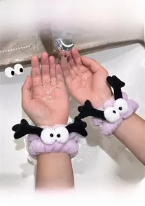 Absorbent purple plush wristbands with cartoon eyes and antlers for washing face