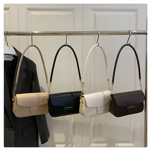 Detail view of stylish PU shoulder bags in four colors with gold metal chains and hardware