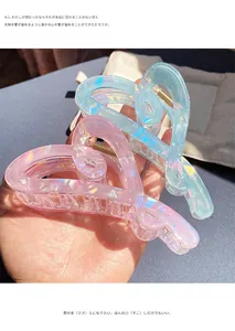 Iridescent jelly color heart hair claw clips in pink and blue with translucent finish