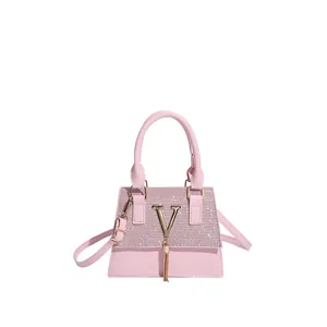 Elegant pink PU leather handbag with glitter flap and golden V buckle for women