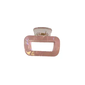 Pink marble texture resin hair claw clip with rectangular design and golden metal spring