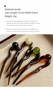 Detail view of U-shaped acetate hair pins in four colors with acrylic material specs