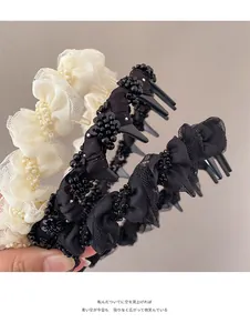 Detail of mesh bubble lace headband featuring hand-sewn beads and anti-slip comb teeth