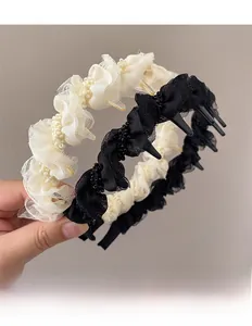 Detail of mesh puff headband with small beads and inner plastic teeth for hair grip