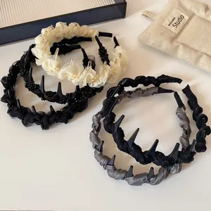 Set of four stylish mesh and lace headbands in cream white, black, and grey colors