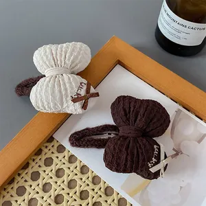 Puffy bow hair clips in cream and coffee tones with Lucky embroidery for women