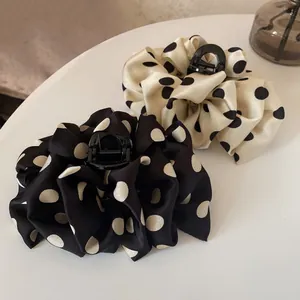 French style polka dot bubble claw clips in black and white satin for voluminous hairstyles