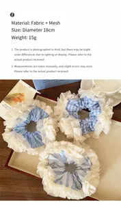 Close-up of oversized blue and white checkered lace hair scrunchies on wooden tray