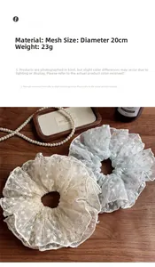 Macro detail of large lace floral scrunchie with embroidery and 20cm diameter size info