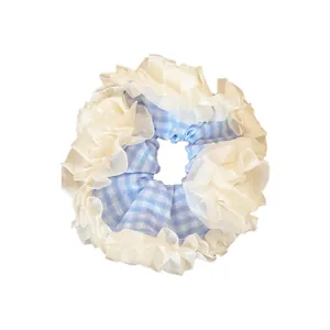 Oversized blue and white checkered scrunchie with four-layer lace trim and striped fabric