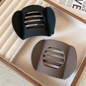 Minimalist matte hair clips set in black and brown featuring hollow rectangle design