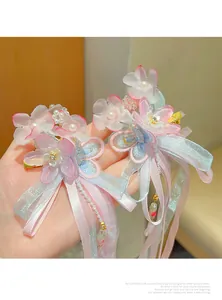 Detail of Hanfu hair clips with embroidery butterflies, silk ribbons, and pearl tassels