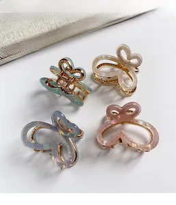 Lot de quatre pinces à cheveux papillon en acétate aux couleurs dégradées pastel