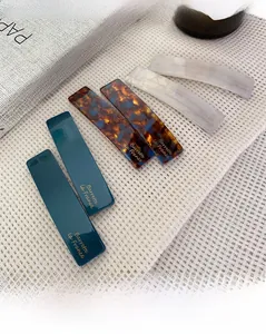 Set of six rectangular acetate hair barrettes in green, tortoise, and pearl white