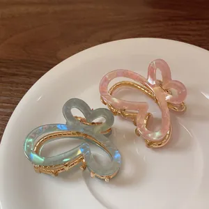 Barrettes papillon en acétate dégradé bleu clair et rose avec finition nacrée élégante