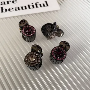 Set of four mini hair clips with sparkling rhinestones in pink and champagne colors