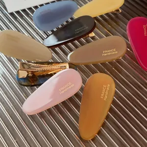 Set de barrettes gouttes en acétate coloré avec logo doré France Handmade élégant