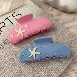 Pink and blue acetate starfish hair claws with 3D starfish and water drop accents
