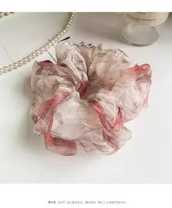 Detailed macro view of the romantic floral organza fabric and vintage rose pattern