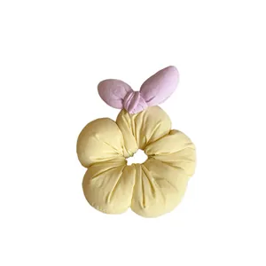 Sweet floral scrunchie in soft light yellow fabric with pink bunny ear bow for girls