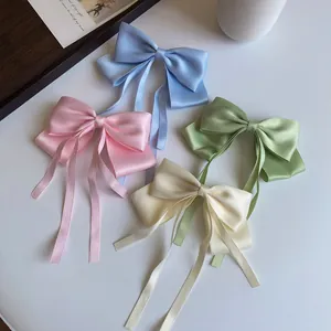 Elegant satin bow hair clips with long ribbons in four pastel colors for women