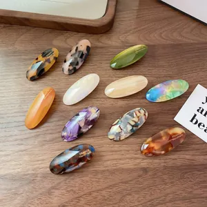 Set of 10 vintage acetate oval hair clips with tortoiseshell and marble patterns