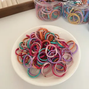 Colorful high-elastic hair bands for girls with cherry patterns in a white tray