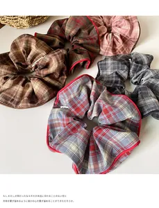 Detailed view of various colorful checkered hair scrunchies with contrast edging texture