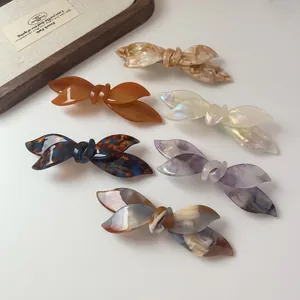 Elegant cellulose acetate bow hair clips in multiple tortoise shell patterns and colors