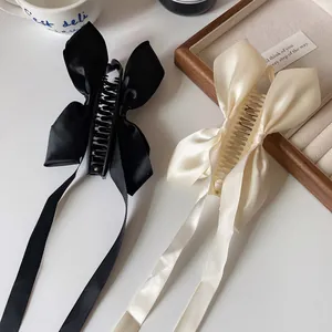 Barrettes à cheveux élégantes avec nœud en satin noir et beige et rubans longs