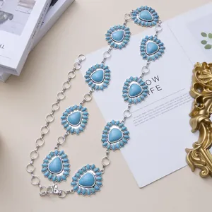 Bohemian silver waist chain featuring turquoise heart pendants and retro metal rings