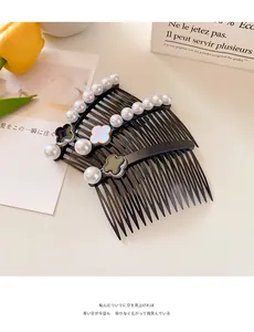 Detail of Korean resin hair combs with elegant pearls and colorful clover motifs