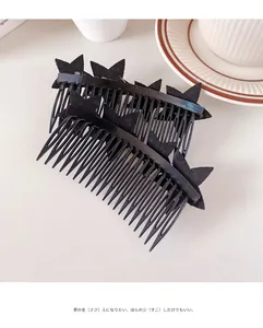 Detail shot of black star hair combs set with glossy finish for elegant styling