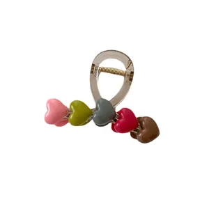 Elegant champagne hair claw with colorful 3D resin hearts and metal spring