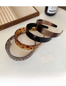 Three-piece non-slip headbands set in leopard print, classic black, and tortoiseshell resin
