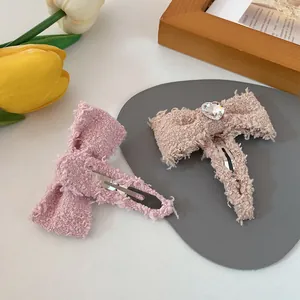 Pink and beige tweed bow hair clips set with heart crystal detail and metal BB clips