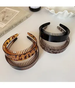 Close-up of leopard print and solid nonslip headbands with inner teeth detail