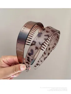 Detail view of anti-slip inner teeth on leopard print and brown gradient hairbands