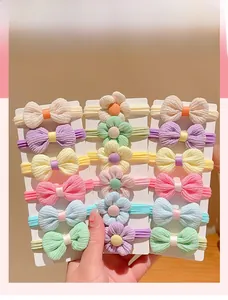 Close-up of 18-piece macaron color elastic hair ties with bows and flowers for girls