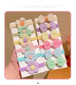 Set of 12 soft elastic baby hair bands with fabric flowers and delicate bows