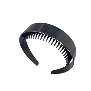 Minimalist black non-slip headband with fine teeth for a high-volume hair styling look